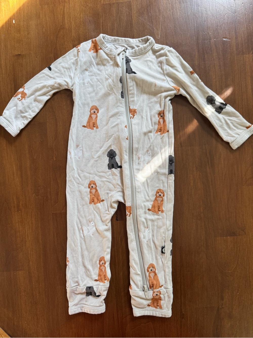 Kyte BABY Cream Zippered One-Piece with Orange and Gray Puppy Print